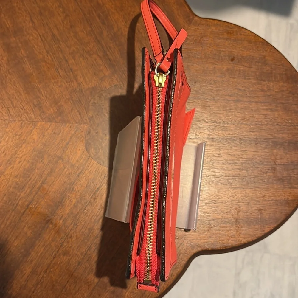 Kate Spade wristlet  pebble leather/patent bow on front  orangeish red gold NWOT